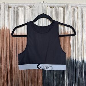 Black Ethika high neck performance style sports bra with silver accents